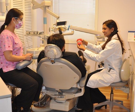 Dr.Harmanpreet Kaur interacting with patient